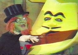 Evil magician Hoo-Doo, played by Charles Nelson Reilly, hatches a scheme with a giant foam gangster hat.
